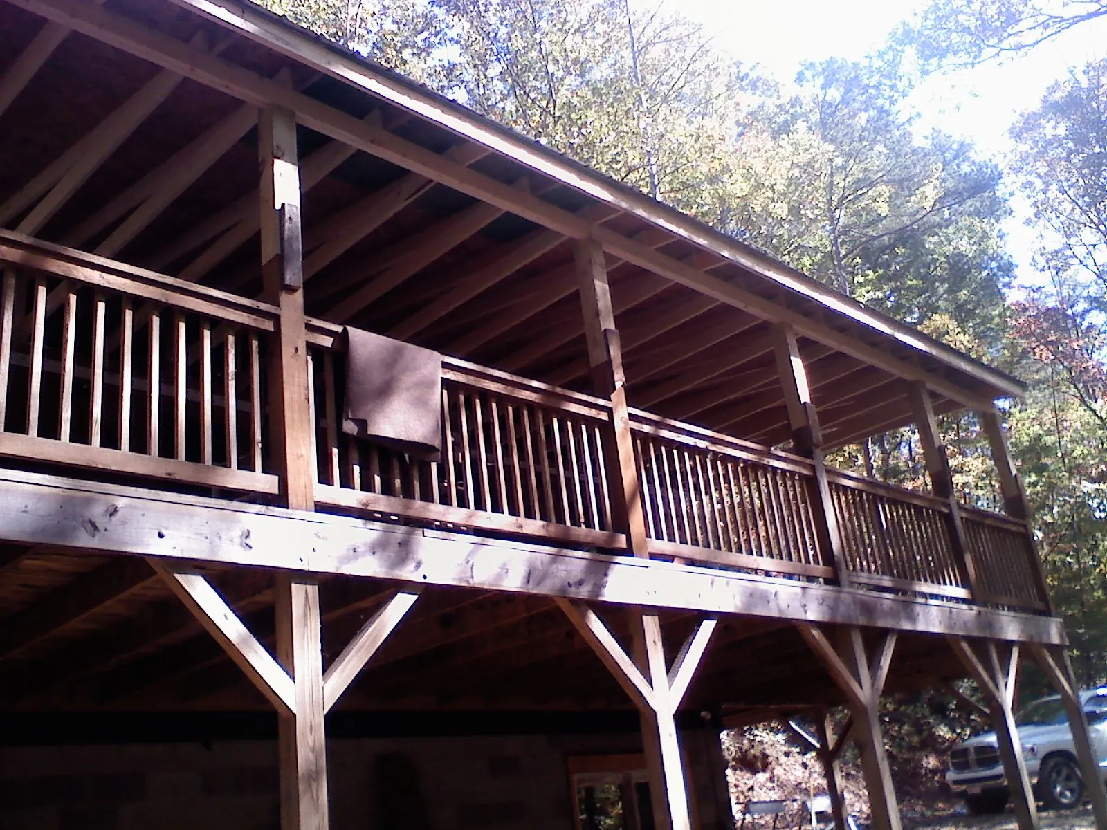 Timber framing under a new elevated porch and deck — Roof Leak Repair in Penfield by Roofing Brothers
